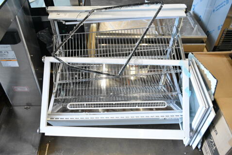 BRAND NEW SCRATCH AND DENT! Avantco Metal Commercial Countertop Display Case Merchandiser. See Pictures for Damage. 115 Volts, 1 Phase. 