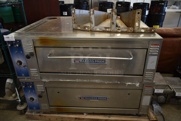 2 Bakers Pride Stainless Steel Commercial Natural Gas Powered Single Deck Pizza Ovens w/ Thermostatic Controls and 1 Deck of Cooking Stones. 208 Volts, 3 Phase. Comes w/ 4 Legs. 2 Times Your Bid!