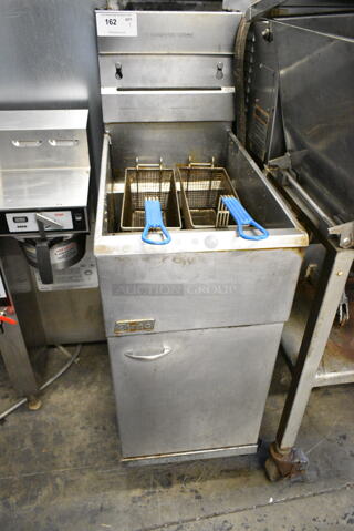 Pitco Frialator Stainless Steel Commercial Floor Style Natural Gas Powered Deep Fat Fryer w/ 2 Metal Fry Baskets on Commercial Casters. 