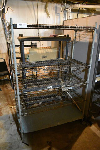 2 Various Shelving Units Including Metal 4 Tier Wire and 4 Tier Black Poly. 42x20x63, 33x18x57. 2 Times Your Bid! (basement) 