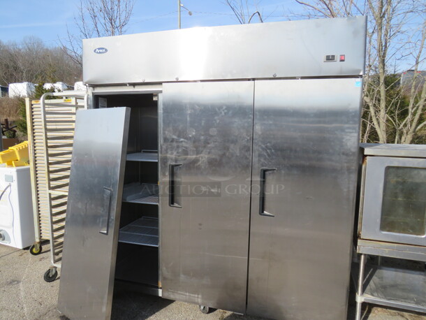 One Atosa 3 Door Stainless STeel Freezer With 9 Racks On Casters. 115/208-230 Volt. 1 Phase. Model# MBF8003. 78X32X82. Door Needs To Be Reattached. 
