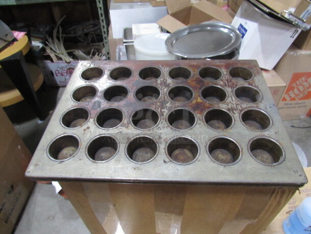 One Commercial 24 Hole Muffin Bake Pan.