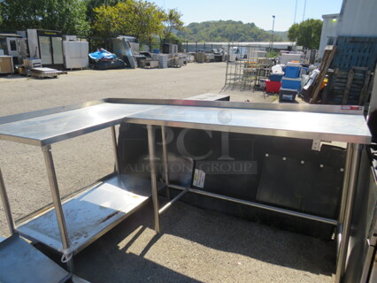 One Stainless Steel Table With Back Splash And A 46X26 Stainless Steel Under Shelf. 90X50X40