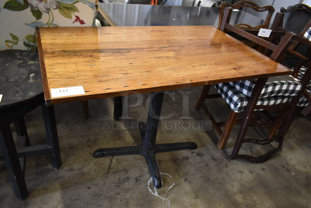 Wooden Dining Height Table on Black Metal Table Base.