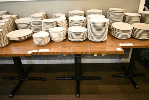 Wood Pattern Dining Height Table w/ Contents Including Ceramic Dishes. (main dining room)