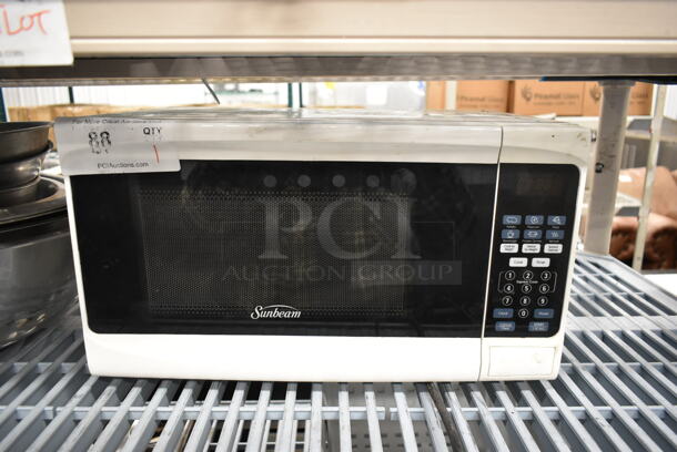 Sunbeam SGS10701 Metal Countertop Microwave Oven w/ Plate. 120 Volts, 1 Phase. 
