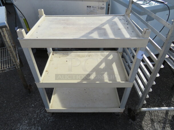One 3 Shelf Cart On Casters. 27.5X16X35