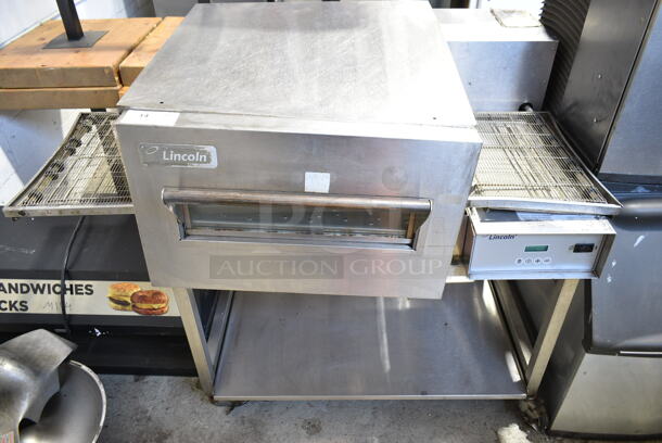 Lincoln Impinger 1132-002-U-K1841 Stainless Steel Commercial Floor Style Electric Powered Conveyor Pizza Oven w/ Under Shelf on Commercial Casters. 208 Volts, 3 Phase. - Item #1116771