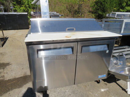 One WORKING 2 Door Turbo Air Refrigerated Prep Table With 2 Racks, A Cutting Board On Casters. Model# MST-48. 115 Volt. 48X32X35