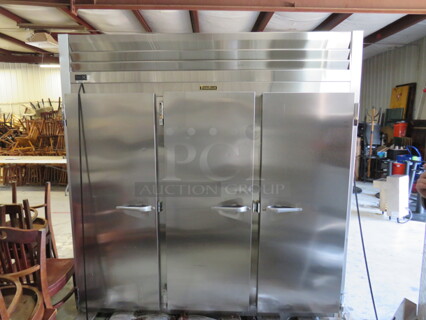 One Traulsen 3 Door Stainless Steel Refrigerator With 9 Racks. 115 Volt. Model# G30011-032. 76.5X32X84