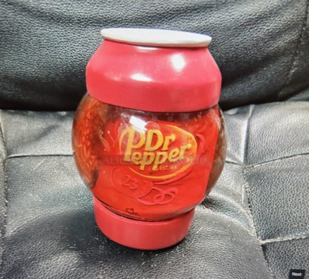 One DR Pepper Band In A Bottle Snow Globe.