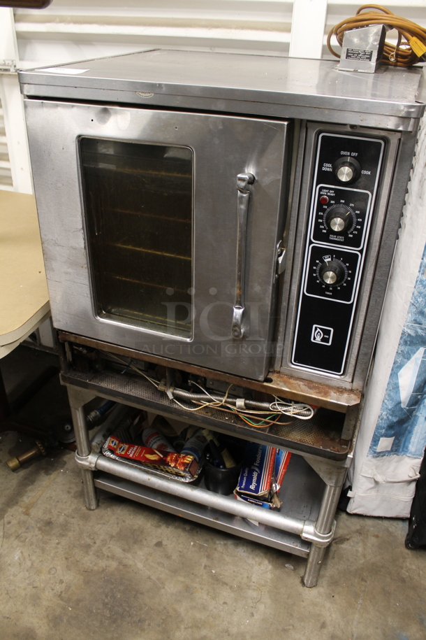 Blodgett Stainless Steel Commercial Natural Gas Powered Half Size Convection Oven w/ View Through Door, Metal Oven Racks and Thermostatic Controls on Stand.
