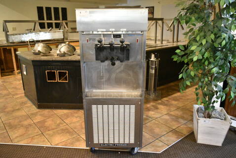 Electro Freeze SL500-132 Stainless Steel Commercial Floor Style 2 Flavor w/ Twist Soft Serve Ice Cream Machine on Commercial Casters. 208-230 Volts, 3 Phase. (main dining room)