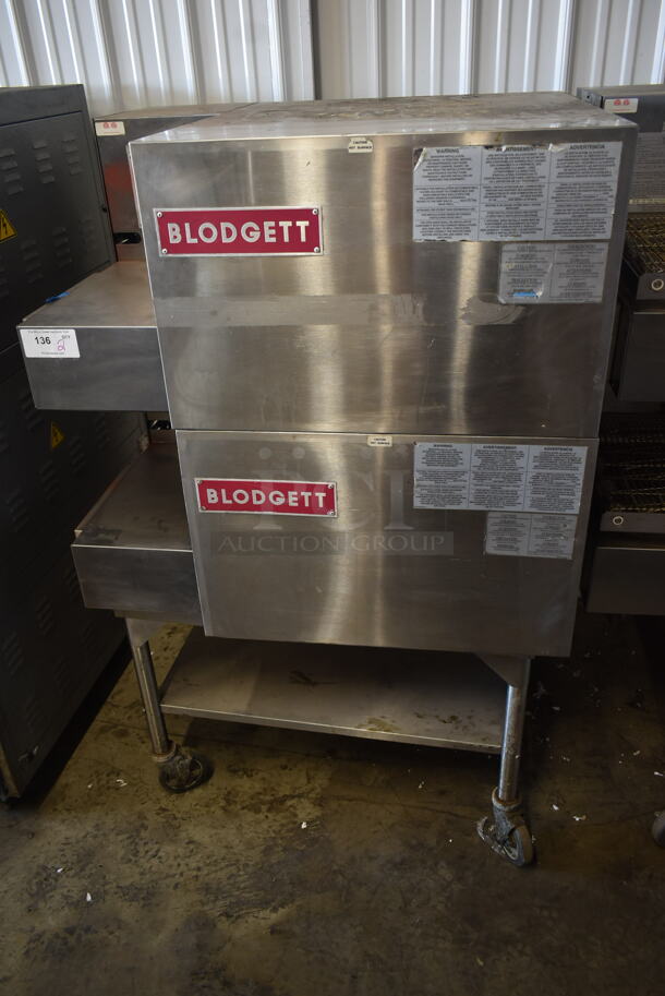 2 Blodgett MT1828G00097 Stainless Steel Commercial Natural Gas Powered Conveyor Pizza Ovens on Equipment Stand w/ Commercial Casters. 38,000 BTU. 2 Times Your Bid!