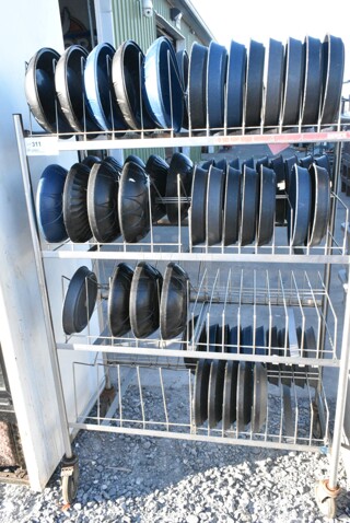 Metal 4 Tier Shelving Unit on Commercial Casters w/ 64 10" Plates. BUYER MUST DISMANTLE. PCI CANNOT DISMANTLE FOR SHIPPING. PLEASE CONSIDER FREIGHT CHARGES.