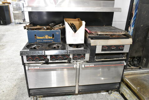 Garland Metal Commercial Natural Gas Powered 6 Burner Range w/ Flat Top Griddle, 2 Ovens, Back Splash and Over Shelf on Commercial Casters. 