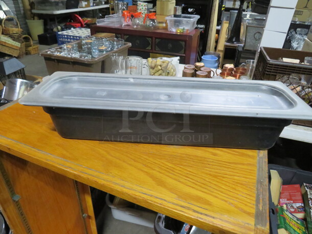 One Black Cambro Half Size Long 4 Inch Deep Food Storage Container With Lid. 