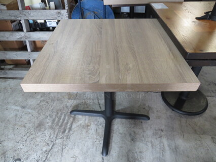 One Wooden Butcher Block Look Table Top On A Pedestal Base. 30X30X30