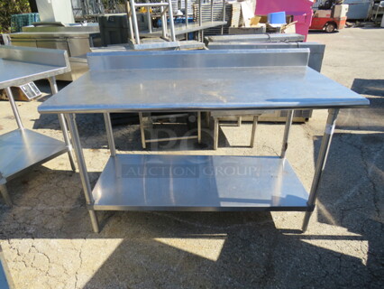 One Stainless Steel Table With Back Splash And SS Under Shelf. 60X30X40