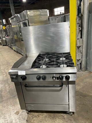 Southbend Heavy Duty Commercial Natural Gas Powered 4 Burner Stove! With Left Sidle Flat Griddle! With Raised Back Splash! With Oven Underneath! All Stainless Steel! On Casters! Model P32DBBB!