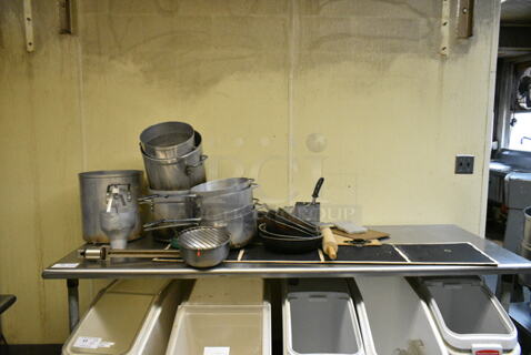 Stainless Steel Table w/ Contents Including Metal Stock Pots, Dough Dropper, Metal Sauce Pans and Skillets. (kitchen)