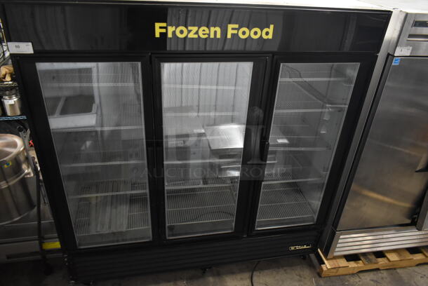 True GDM-72F-HC-TSL01 Metal Commercial 3 Door Reach In Freezer Merchandiser w/ Poly Coated Racks on Commercial Casters. 115/208-230 Volts, 1 Phase.