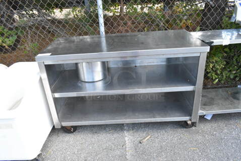 Stainless Steel Table w/ 2 Under Shelves on Commercial Casters. 