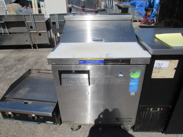 One SS Everest 1 Door Refrigerated Prep Table With Cutting Board On Casters. Model# EPBNR1. 115 Volt. 28X32X43.5