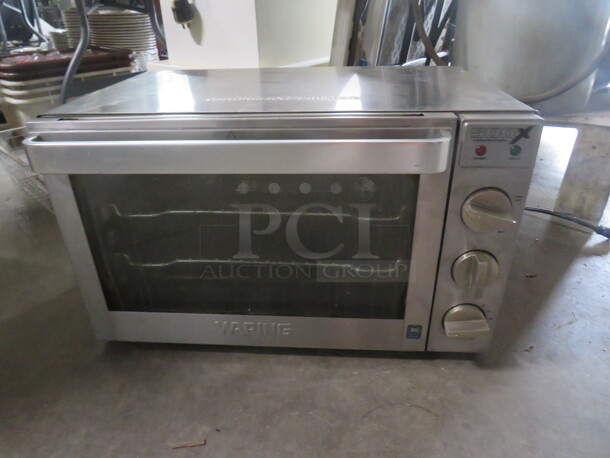 One WORKING Stainless Steel Waring 1/2 Size Convection Oven With 2 Racks. 120 Volt. 1700 Watt. Model# WCO500X. 24X20.5X14