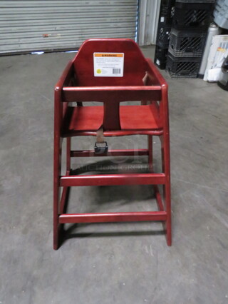 One Wooden High Chair With Safety Straps.