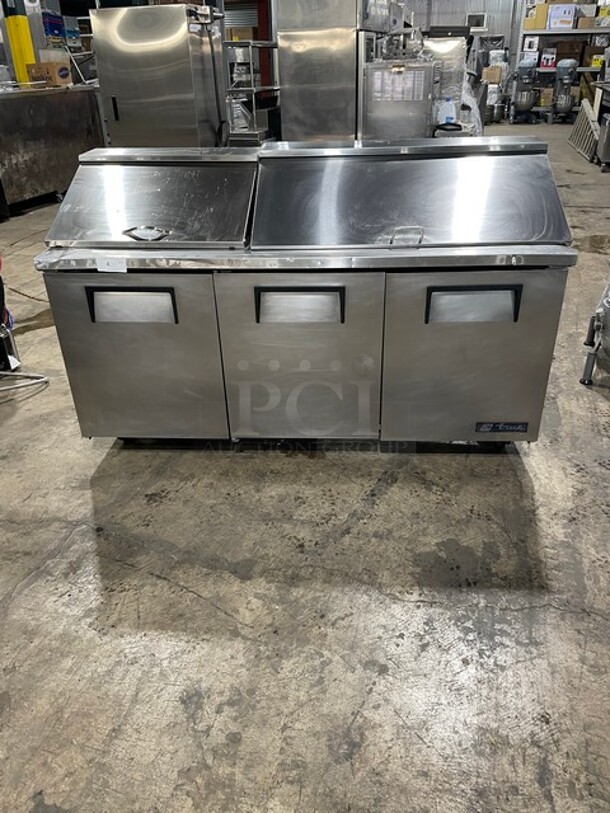 True Mega Top Sandwich/Salad Prep Table! All Stainless Steel! With 3 Door Refrigerated Storage Underneath! With poly Coated Racks! 115V 1 Phase! On Casters! Model: TSSU-72-18 SN: 1-4477571! - Item #1145118