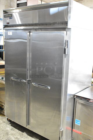 Continental 2R Stainless Steel Commercial 2 Door Reach In Cooler on Commercial Casters. 115 Volts, 1 Phase. 