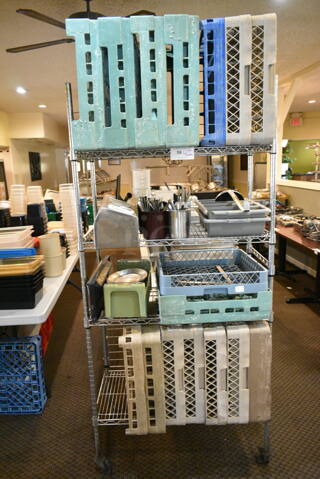 Chrome Finish 4 Tier Wire Shelving Unit on Commercial Casters w/ Contents Including Poly Caddies, Utensils. BUYER MUST DISMANTLE. PCI CANNOT DISMANTLE FOR SHIPPING. PLEASE CONSIDER FREIGHT CHARGES. (main dining room)