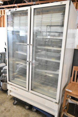 Carrier ULG50BCP-5 Metal Commercial 2 Door Reach In Freezer Merchandiser w/ Poly Coated Racks on Commercial Casters. 115/208-230 Volts, 1 Phase.