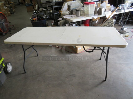 One Poly Folding Table With A Carry Handle. 72X30X29