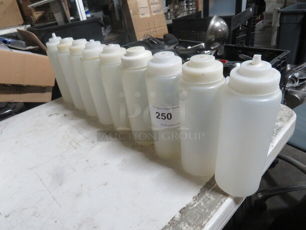One Lot Of 9 Squeeze Bottles With Lids.