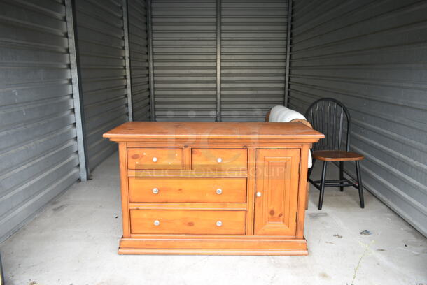 ALL ONE MONEY! Lot of Entire Contents of Storage Unit #33. Unit Size: 10'x20'. Unit Appears to Contain: Wooden 4 Drawer Dresser, Wooden Dining Chair and Blanket Rack. Cleaning Deposit of $100 per Unit Paid on Pickup Day. Winner Has 7 Days From Close of Auction to Remove Items. All Items Must Be Removed and Unit Must Be Broom Swept to Get Cleaning Deposit Returned.