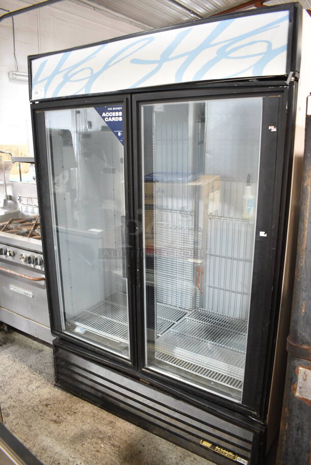 True GDM-49F Metal Commercial 2 Door Reach In Freezer Merchandiser w/ Poly Coated Racks. 115/208-230 Volts, 1 Phase. 