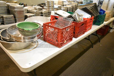 Dining Height Folding Table w/ Contents Including Stainless Steel Drop In Bin Lids, Sifter, Colanders, Bowls, Poly Lids. (main dining room)