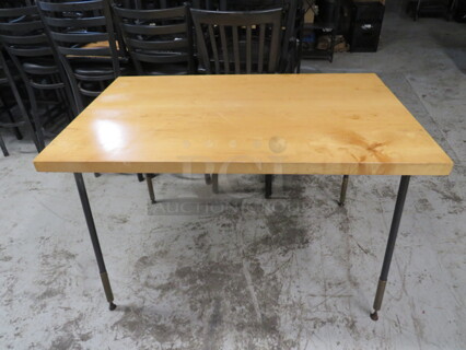 One 1-3/4 Inch Thick Light Oak Table On Black Metal Legs. 48X30X31