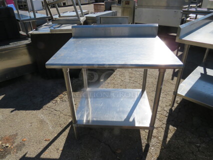 One Stainless Steel Table With Back Splash And SS Under Shelf. 36X30X40