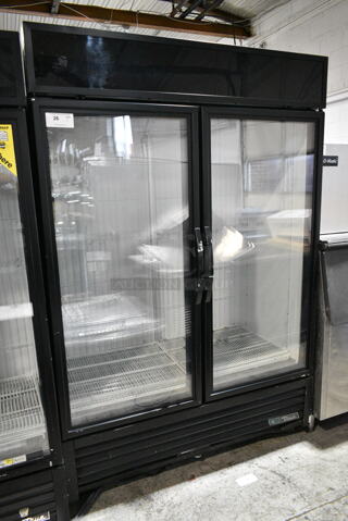 2017 True GDM-49F-HC Metal Commercial 2 Door Reach In Freezer Merchandiser w/ Poly Coated Racks on Commercial Casters. 115/208-230 Volts, 1 Phase. 