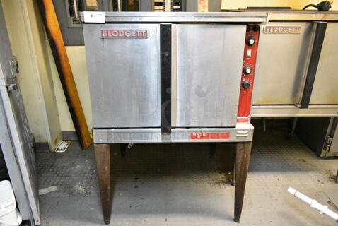 Blodgett Mark V Stainless Steel Commercial Electric Powered Full Size Convection Oven w/ Solid Doors, Metal Oven Racks and Thermostatic Controls on Metal Legs. (kitchen)