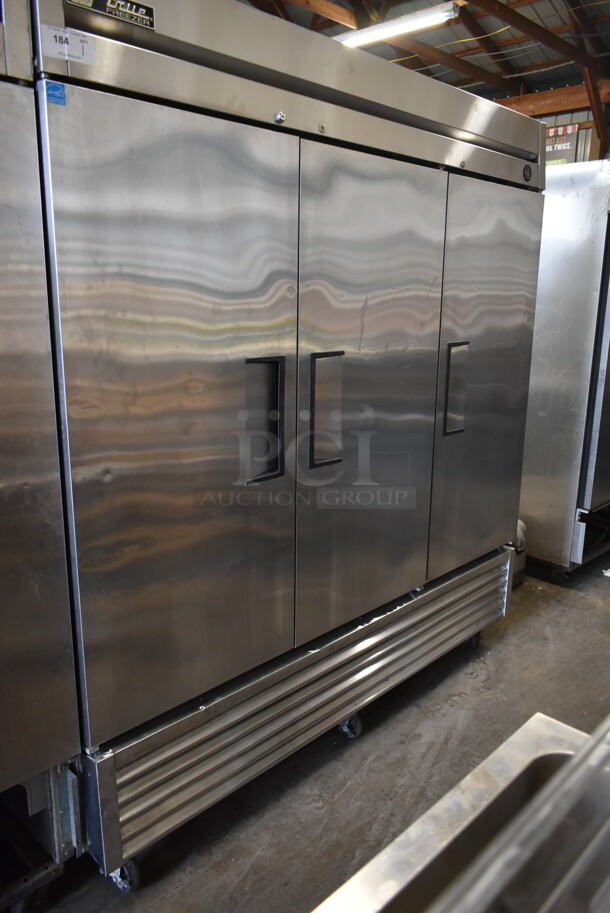 2015 True T-72F ENERGY STAR Stainless Steel Commercial 3 Door Reach In Freezer w/ Poly Coated Racks on Commercial Casters. 115 Volts, 1 Phase. Tested and Working!