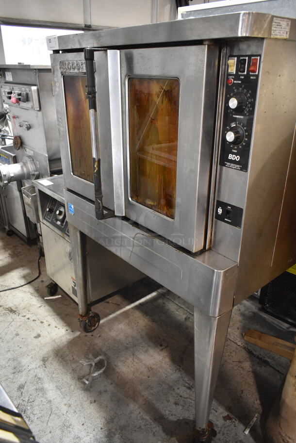 Blodgett BDO-100-G-ES Stainless Steel Commercial Natural Gas Powered Full Size Convection Oven w/ View Through Doors, Metal Oven Racks, Thermostatic Controls and Metal Legs on Commercial Casters. - Item #1116865