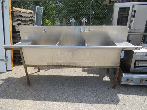 One Stainless Steel 3 Compartment Sink With R/L Drain Board And 2 Faucets.