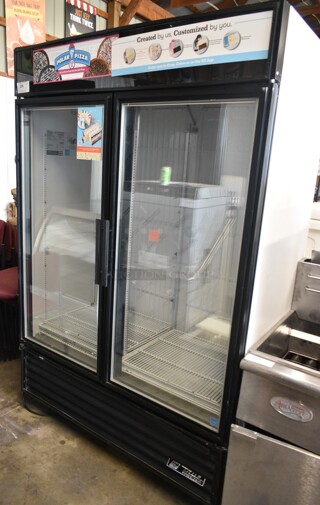 True GDM-49F-LD ENERGY STAR Metal Commercial 2 Door Reach In Freezer Merchandiser w/ Poly Coated Racks on Commercial Casters. 115/208-230 Volts, 1 Phase. 