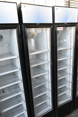 BRAND NEW SCRATCH AND DENT! Galaxy 177GDN5RBB Metal Commercial Single Door Reach In Cooler Merchandiser w/ Poly Coated Racks and Red, White, and Blue LED Lighting. 110-120 Volts, 1 Phase. 