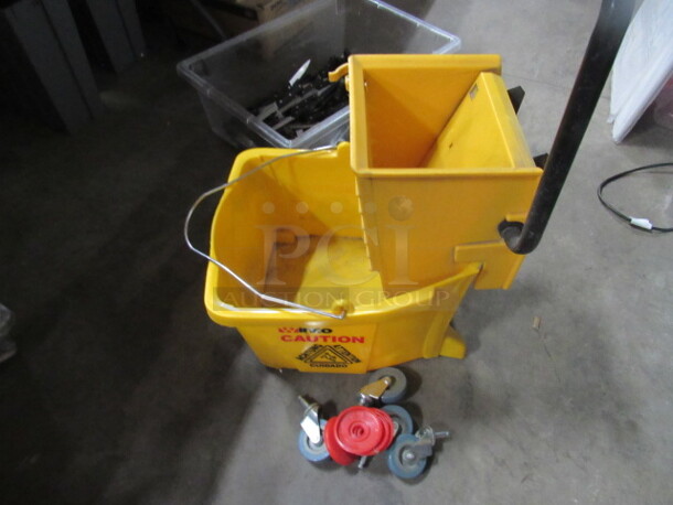One NEW Mop Bucket And Wringer. Assembly Required.