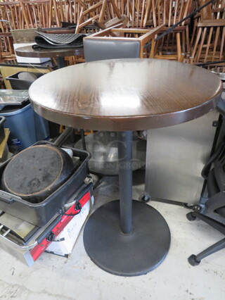 One 2 Inch Thick Solid Wood Round Table On A  Bar Height Pedestal Base. 30X30X42.